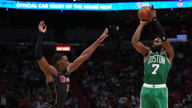 Nov 4, 2021; Miami, Florida, USA; Boston Celtics guard Jaylen Brown (7) shoots over Miami Heat center Bam Adebayo (13) during the second half at FTX Arena. Mandatory Credit: Jasen Vinlove-USA TODAY Sports